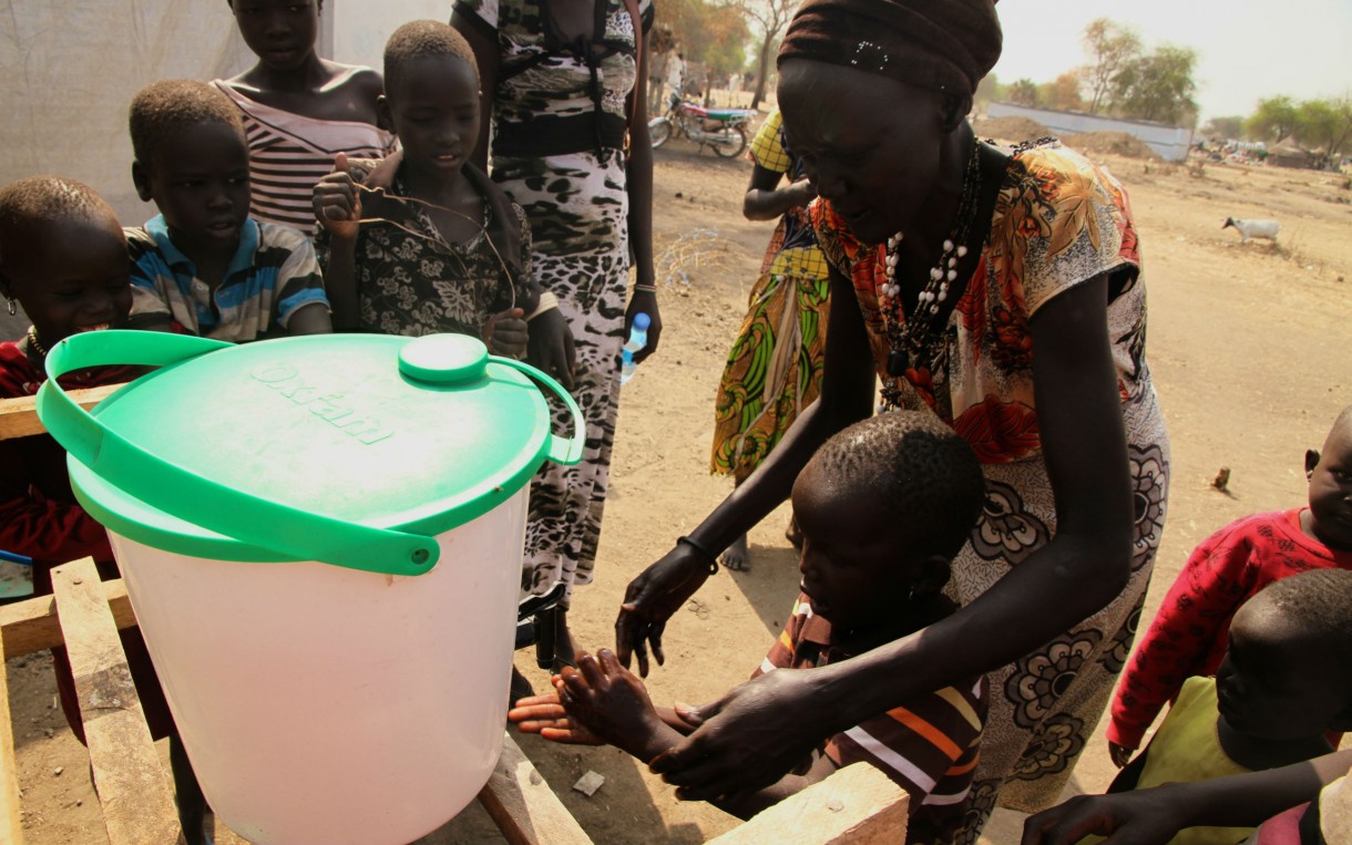 Martha Nyandeng teaches children how to use latrines and properly wash their hands. Photo: Aimee Brown/Oxfam