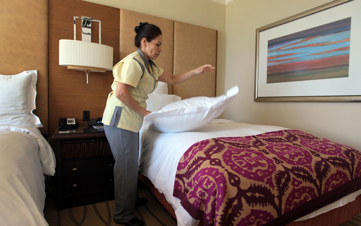 Housekeeper Maria Antonieta prepares a room at the Ritz-Carlton in Key Biscayne, Fla. Nearly a million people work as maids and housekeepers in the US, with a median hourly wage of under $10, according to the Bureau of Labor Statistics. Photo: Joe Raedle / Getty Images
