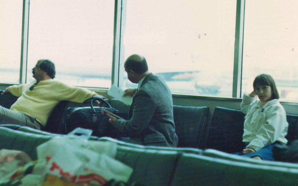 The author fled Romania with her parents in 1985. Here she is pictured (right) at Charles de Gaulle Airport in Paris on her way to the US.