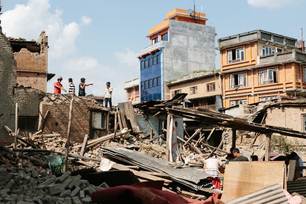 People search their home for belongings in Sankhu, a town in Kathmandu Valley where 980 houses collapsed in the April 25, 2015, earthquake. Photo: Aubrey Wade/Oxfam