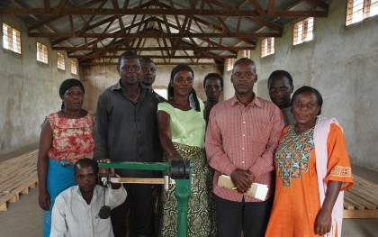 Pictured are members of a cooperative of rice farmers in the Shinyanga region of Tanzania. The group is 1) constructing dams to harvest rainwater and combat the impacts of climate change, 2) taking collective action against price-fixing traders who until now, have controlled how much farmers can receive for their rice, and 3) raising awareness on the need for women's land rights to be recognized and upheld. Photo: Mora McLagan / Oxfam