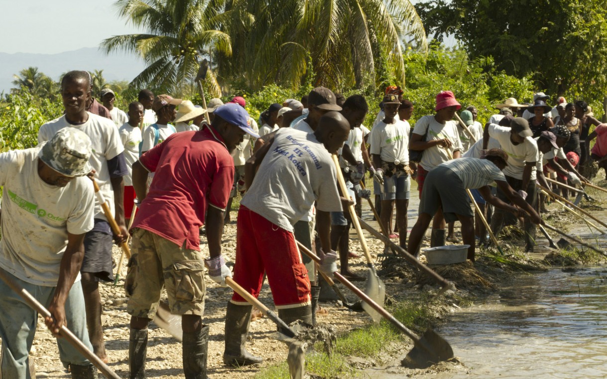 The mayor of Grande-Saline in rural Artibonite, Haiti enlisted support from Oxfam in 2011 to address flood control. Through a cash-for-work program, two 132-member work teams helped clean out drainage channels that serve about 2,000 people in the area. Photo: Chris Hufstader / Oxfam America